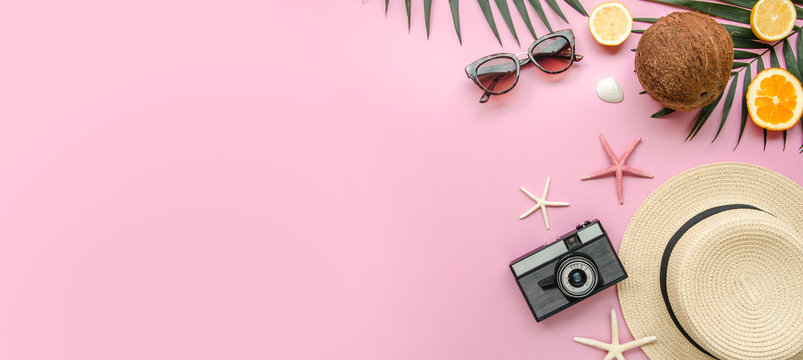 Summer Holiday Trip Concept, Top View Beach Women's Accessories: Straw Hat, Sunglasses And Sea On A Pink Background. Vacation Banner With Copy Space