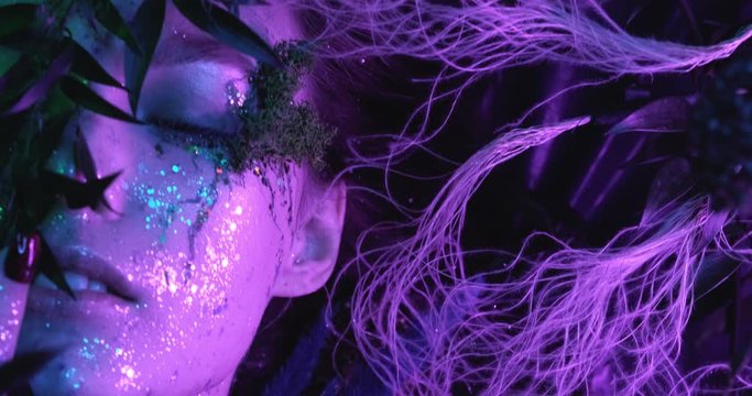 mysterious dark elf got terrible curse, charming girl with horns on head. glowing sparkling magic staff in hands damned lady. storm purple electric fire creative art. character Maleficent Ancient mage