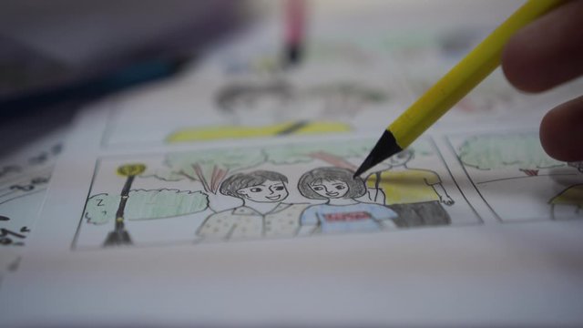 Designer or creative discussion in drawing storyboard for film movie,Video Pre-production process media films in form display script production. Business of media clip, design shot layout in studio,4K