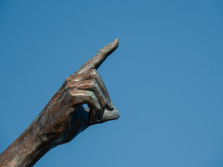Fototapeta na wymiar SAINT RAPHAEL, FRANCE - JANUARY 1, 2020: The pointing bronze hand.