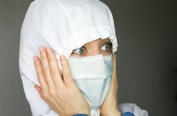 Sick woman wear a medical face mask against virus and protecting herself. Self protection.