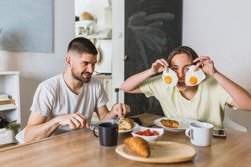 romantic couple having breakfast at home
