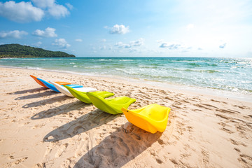 Row of Colorful Sunbathing Chairs on the Sao Beach of Phu Quoc Island, Vietnam, a Tourism Destination for Summer Vacation in Southeast Asia, with Tropical Climate and Beautiful Landscape.