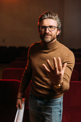 emotional stage director with scenario gesturing on rehearse in theater