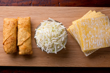 Eggrolls or Springrolls. Traditional Chinese, Thai or Japanese restaurant appetizer, fried. Made from wonton wrappers & filled with Chinese veggies and served w/ a chili dipping sauce or soy sauce.  