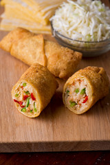 Eggrolls or Springrolls. Traditional Chinese, Thai or Japanese restaurant appetizer, fried. Made from wonton wrappers & filled with Chinese veggies and served w/ a chili dipping sauce or soy sauce.  
