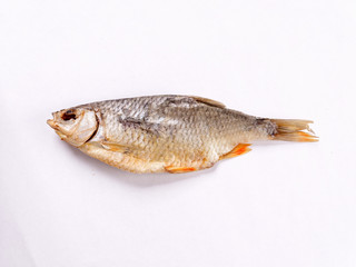 salted dried salted white fish on a white background