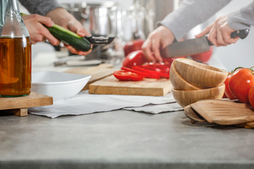 Desk of free space in kitchen interior and woman hands.Sunny day and light of sun from window. 