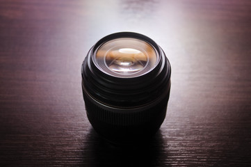 Camera lens aperture with reflections. Backlight with selective focus.