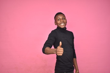 young black man posing with thumbs up gesture