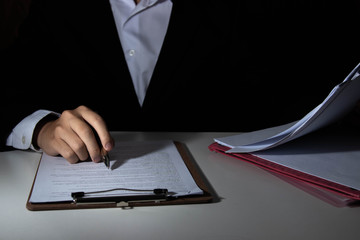 Employees are checking document validity.