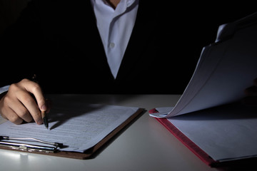 Employees are checking document validity.