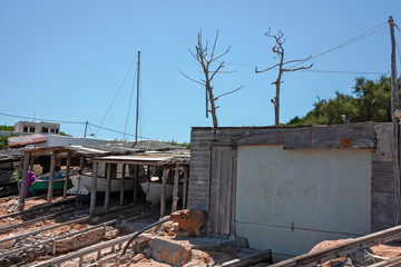 Fototapeta premium Boats pulled ashore in a port of a fishing village in Formentera in the Balearic islands of Spain.