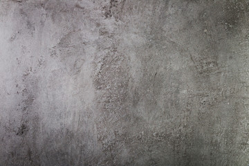 Dark cement wall with coarse surface