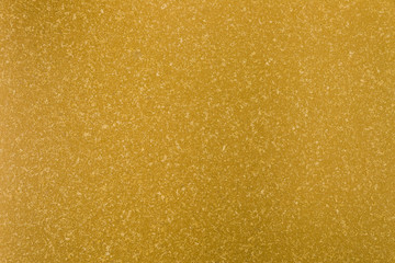 Yellow concrete surface with rough appearance
