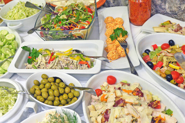 Variety of tasty and fresh food on table close up