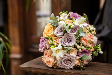 Bouquet of roses on the wooden background, vintage style