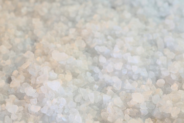 Background coarse-grained salt, spices used in cooking, close-up and shallow depth of field