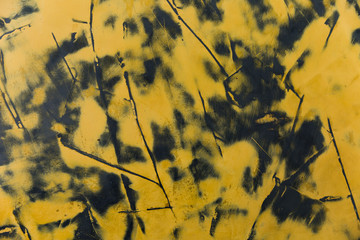 Paint stains on dark concrete wall