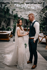 Fototapeta premium portrait of Gorgeous wedding couple in beautiful interior