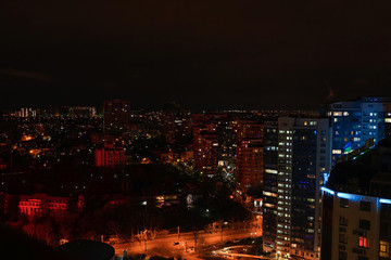 Beautiful view of the night city from the skyscraper of the city of Odessa. Space for text