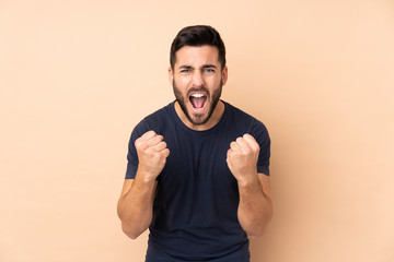 Caucasian handsome man isolated on beige background frustrated by a bad situation