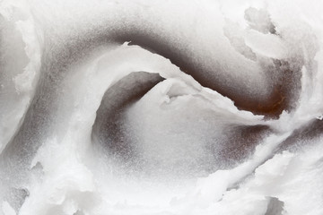 Coconut oil texture. White coco butter in a coconut bowl. Food, cosmetic ingredient, spa treatment