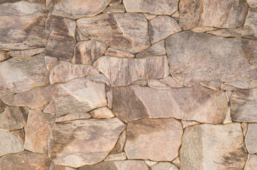 New brown ceramic tiles on wall closeup