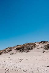 White sand beach with a clear blue sky