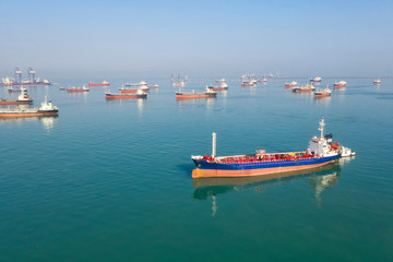 Oil tanker, gas tanker in the high sea.Refinery Industry cargo ship. top view,aerial view,Thailand, in import export, LPG,oil refinery, Logistics and transportation with working crane bridge in harbor