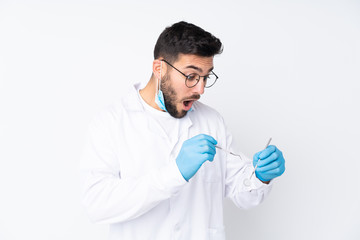 Caucasian dentist man over isolated background