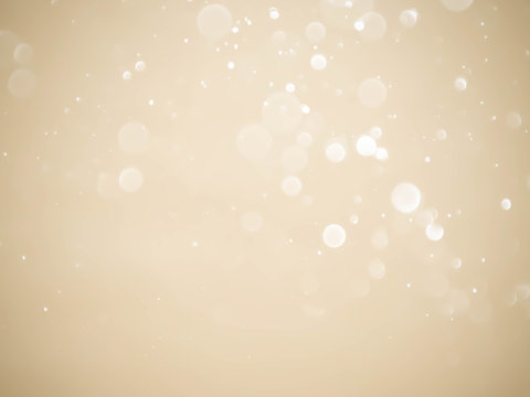 Golden background with soft bokeh lights.