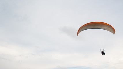 extreme paragliding sports are above the clouds