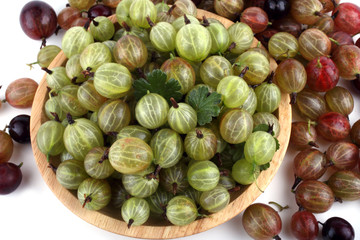 Gooseberrie on plate background. Harvest