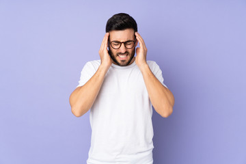 Fototapeta premium Caucasian handsome man over isolated background with headache