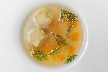 Bean soup with meatballs, vegetables and dill
