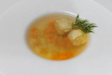 Bean soup with meatballs, vegetables and dill