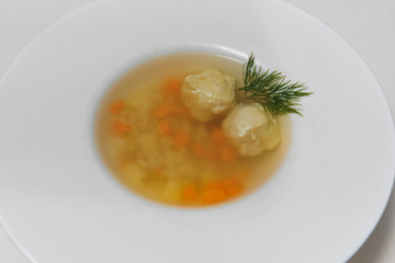 Bean soup with meatballs, vegetables and dill
