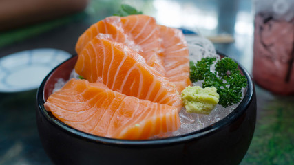 Slide selmon in a desh, selmon sushi japaness food.