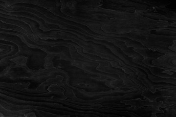 Dark black wooden background. Dark wood texture, wallpaper.