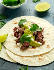 Carne Asada Tacos with grilled steak, green sauce and onion. Mexican food