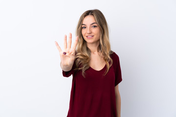 Young woman over isolated white background happy and counting four with fingers