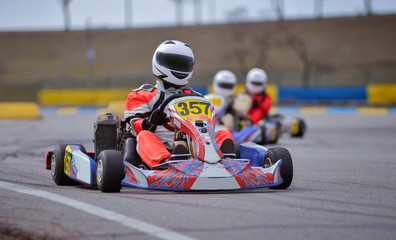 Young go cart racer on circuit - obrazy, fototapety, plakaty