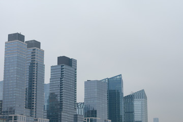 Modern Glass Skyscrapers in the Lincoln Square New York City Skyline on a Foggy Day