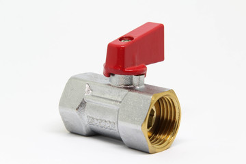 Brass ball valve with red handle on white background.