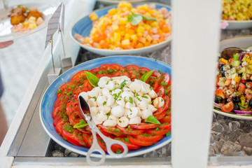 Close up of salad bar with assortment of ingredients