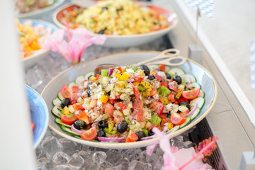 Close up of salad bar with assortment of ingredients