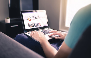 Social media profile on screen. Man using laptop at home. Personal online page. Business network...