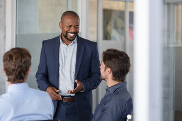 Mature business man in meeting smiling