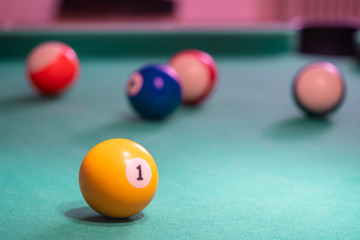 Billiard balls on table. Leisure and gambling concept. Toned image of striped colorful balls